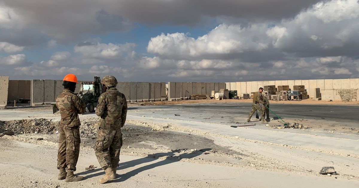 A picture taken on Jan. 13, 2020, during a press tour organized by the US-led coalition fighting the remnants of the Islamic State group, shows U.S. soldiers clearing rubble at Ain al-Asad military airbase in the western Iraqi province of Anbar.