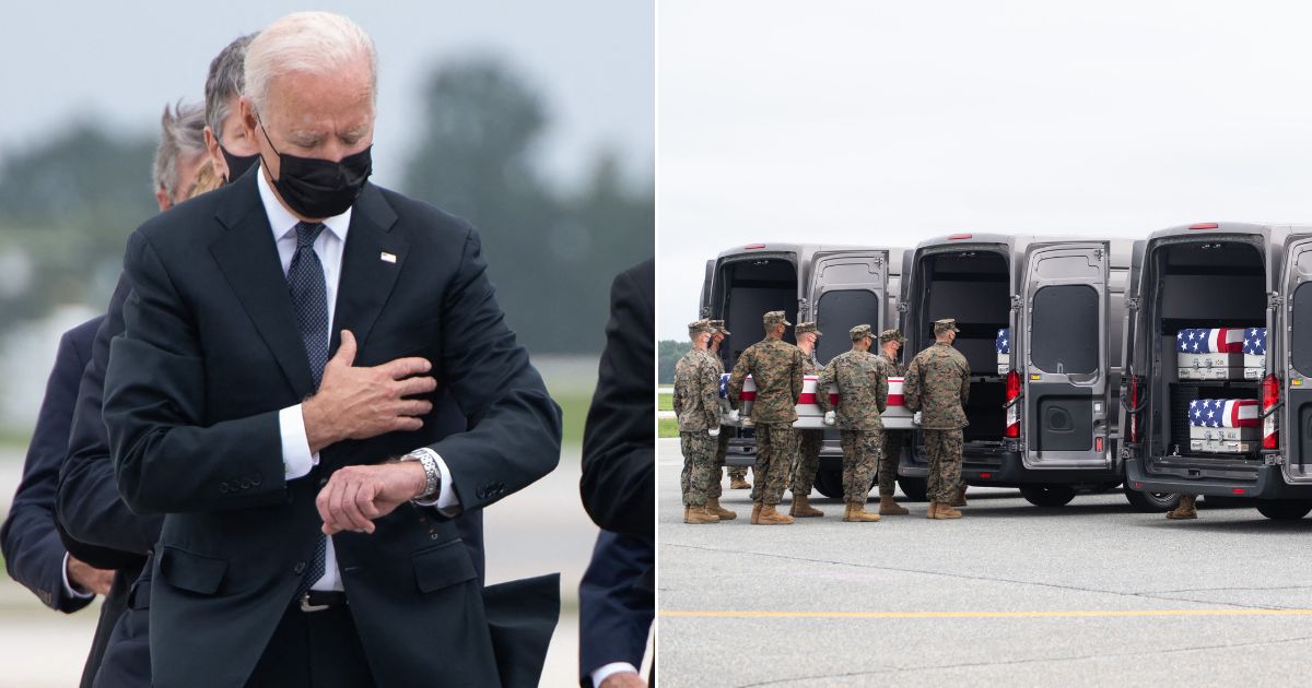 President Joe Biden checks his watch during a service at Dover Air Force Base in Dover, Delaware, Aug. 29, 2021.