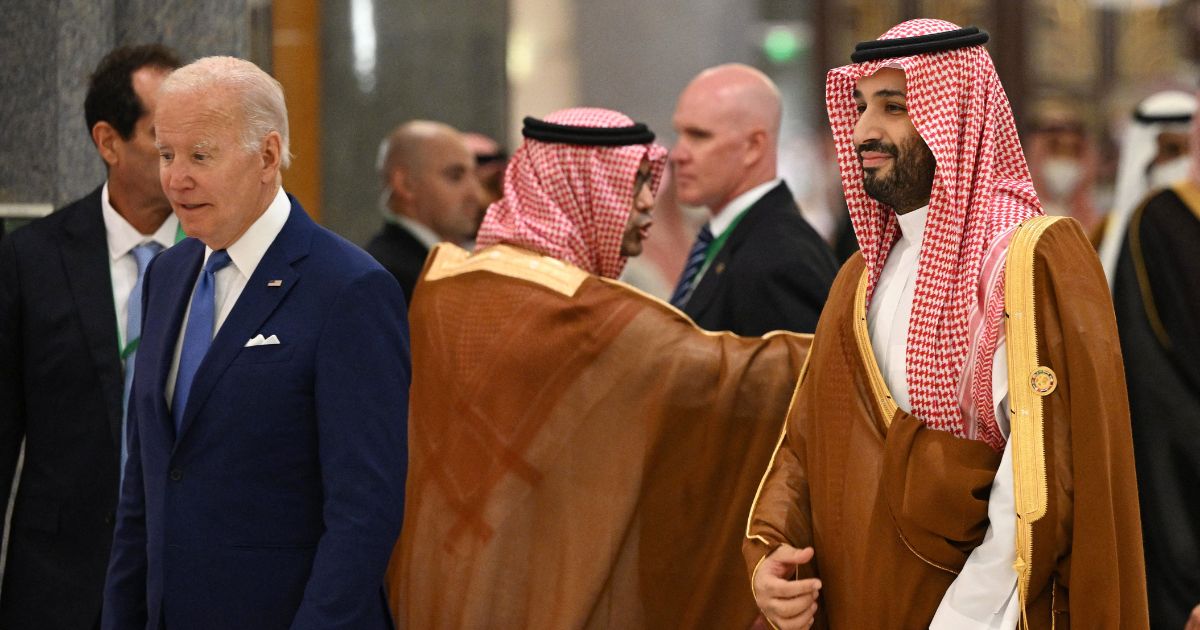 US President Joe Biden (L) and Saudi Crown Prince Mohammed bin Salman (R) arrive for the family photo during the Jeddah Security and Development Summit (GCC+3) at a hotel in Saudi Arabia's Red Sea coastal city of Jeddah on July 16, 2022.