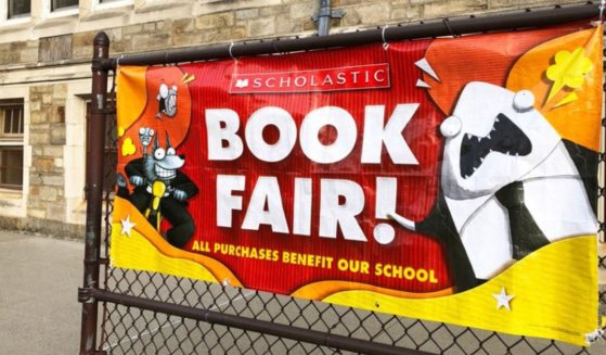 Scholastic is taking heat after a recent decision not to offer books that focus on LGBT themes and racism at book fairs in schools.