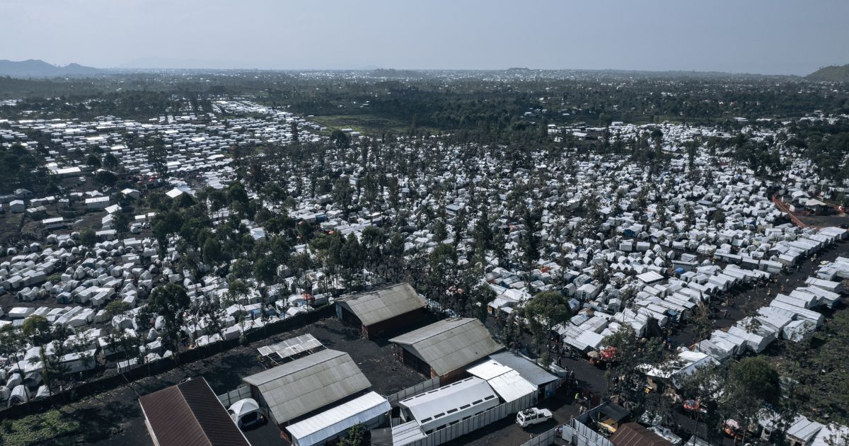 This aerial photograph, taken on October 2, 2023, shows the Rusayo IDP camp, home to tens of thousands of war-displaced people, on the outskirts of Goma in the East of the Democratic Republic of Congo. Since mid-2022, hundreds of thousands of Congolese have found refuge around Goma after fleeing fighting further north between the Congolese army and the Rwandan-backed M23 rebellion.