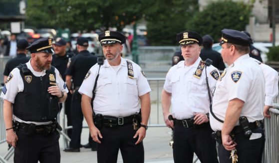 NYPD officers stand guard before the second day of former President Donald Trump civil fraud trial begins at New York State Supreme Court on Tuesday in New York City.