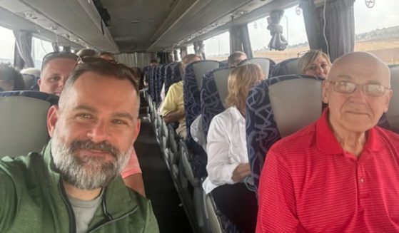 Rep. Cory Mills, a Florida Republican, is pictured with Americans getting out of Israel after the surprise Hamas attack on Saturday ignited war.