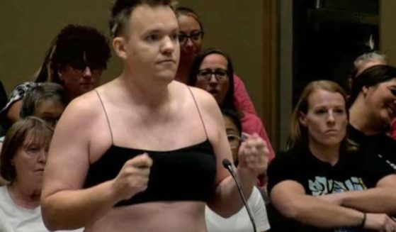 Ira Latham stripped down in protest of proposed dress code policies during an Arizona school board meeting.