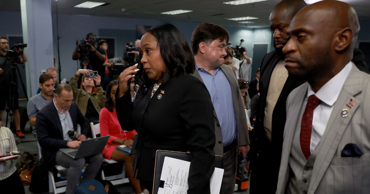 Fulton County District Attorney Fani Willis leaves after speaking at a news conference at the Fulton County Government building on August 14, 2023 in Atlanta, Georgia.