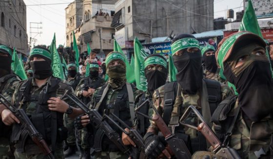 Palestinian Hamas militants are seen during a military show in the Bani Suheila district on July 20, 2017, in Gaza City, Gaza.