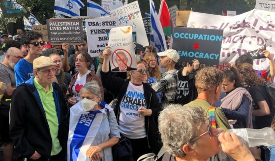 Anti-Israel demonstrators hold signs as Israeli Prime Minister Benjamin Netanyahu addresses the 78th UN General Assembly in New York on Sept. 22.
