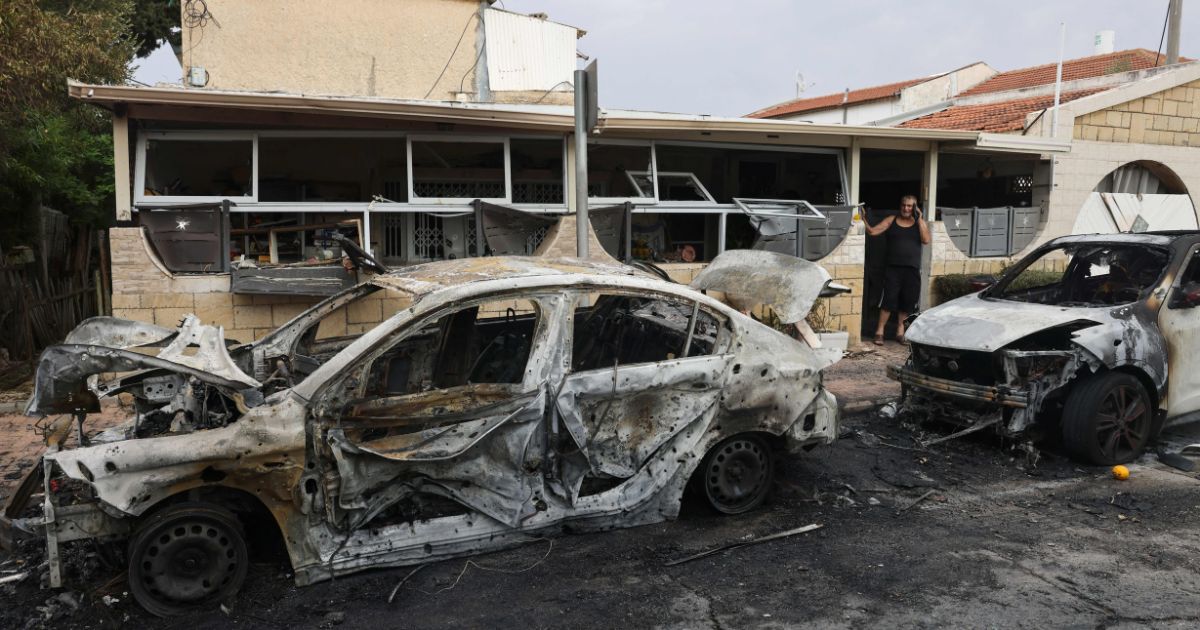 A man inspects the damage in the southern Israeli city of Ashkelon after a rocket attack from Gaza on October 9, 2023.