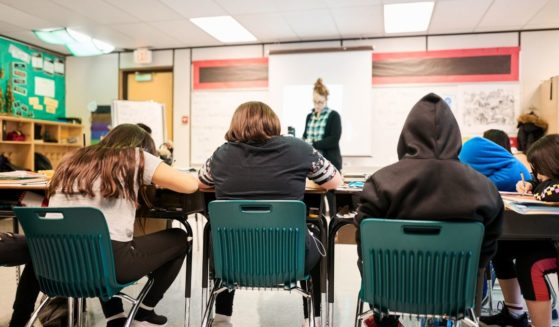 Students sit in class in this stock image.