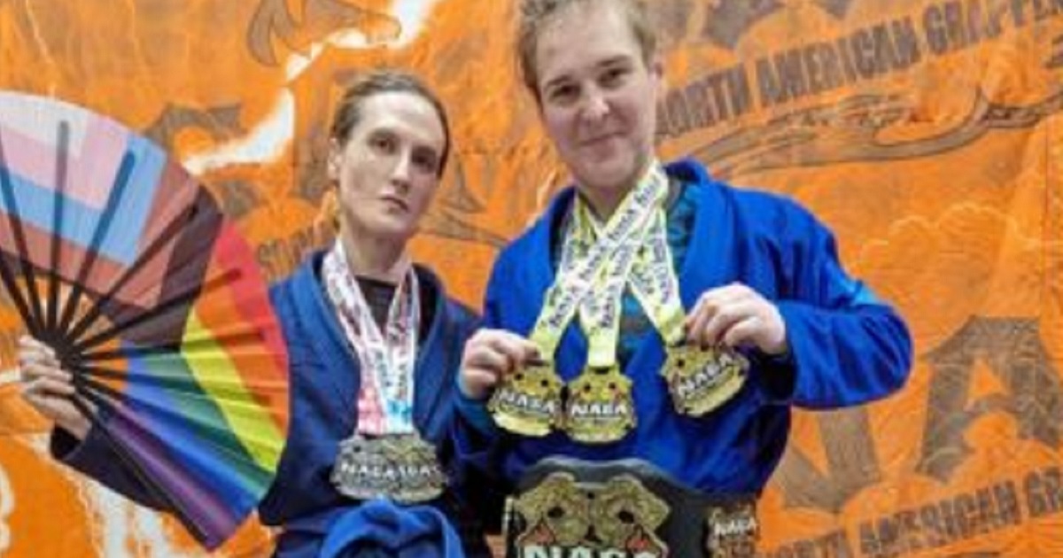 Cordelia Gregory, left, and Corissa Griffith, men identifying as women, post with their medals at the Georgia Grappling & BJJ Championship in October in Marietta, Georgia.