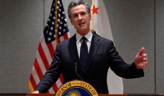 Governor of California Gavin Newsom answers a question during a press conference in Beijing on Wednesday.