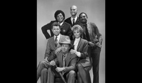 Studio portrait of the cast of the television show, 'Night Court'. L-R clockwise from center: Harry Anderson (with mallet), John Larroquette, Marsha Warfield, Richard Moll, Charles Robinson, and Markie Post.