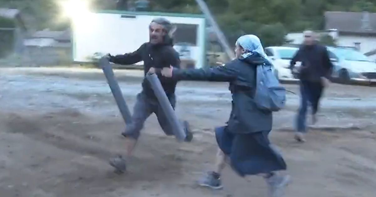 A nun tackles a protester in France.