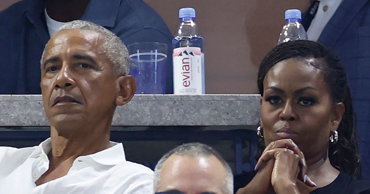 Barack Obama and his wife Michelle Obama look on during the Women's Singles First Round match between Coco Gauff of the United States and Laura Siegemund of Germany on Day One of the 2023 US Open at the USTA Billie Jean King National Tennis Center on August 28, 2023 in the Flushing neighborhood of the Queens borough of New York City.