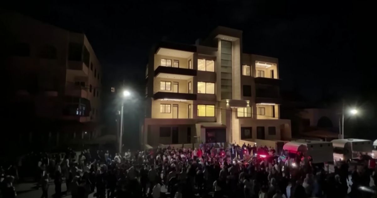 Protesters attempt to storm the Israeli embassy after the Gaza hospital explosion.