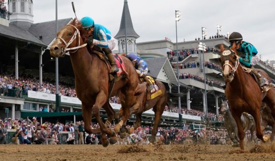 Mage (8), with Javier Castellano aboard, wins the 149th running of the Kentucky Derby horse race at Churchill Downs May 6 in Louisville, Kentucky.