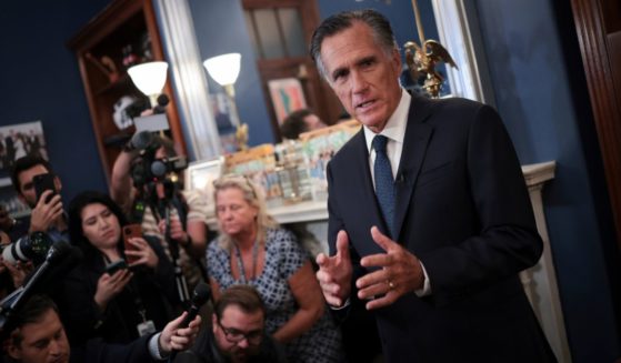 Sen. Mitt Romney (R-UT) answers questions in his office after announcing he will not seek re-election on Sept. 13 in Washington, D.C.