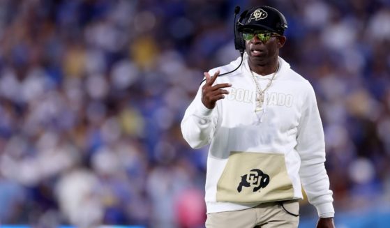Head coach Deion Sanders of the Colorado Buffaloes looks on from the sidelines during the first half of a game against the UCLA Bruins at Rose Bowl Stadium on Saturday in Pasadena, California.