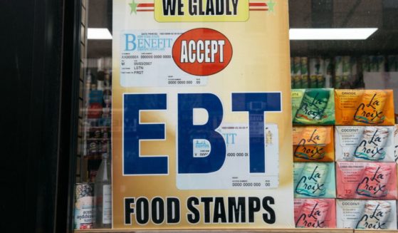 A sign alerting customers about SNAP food stamps benefits is displayed at a Brooklyn grocery store on Dec. 5, 2019, in New York City.
