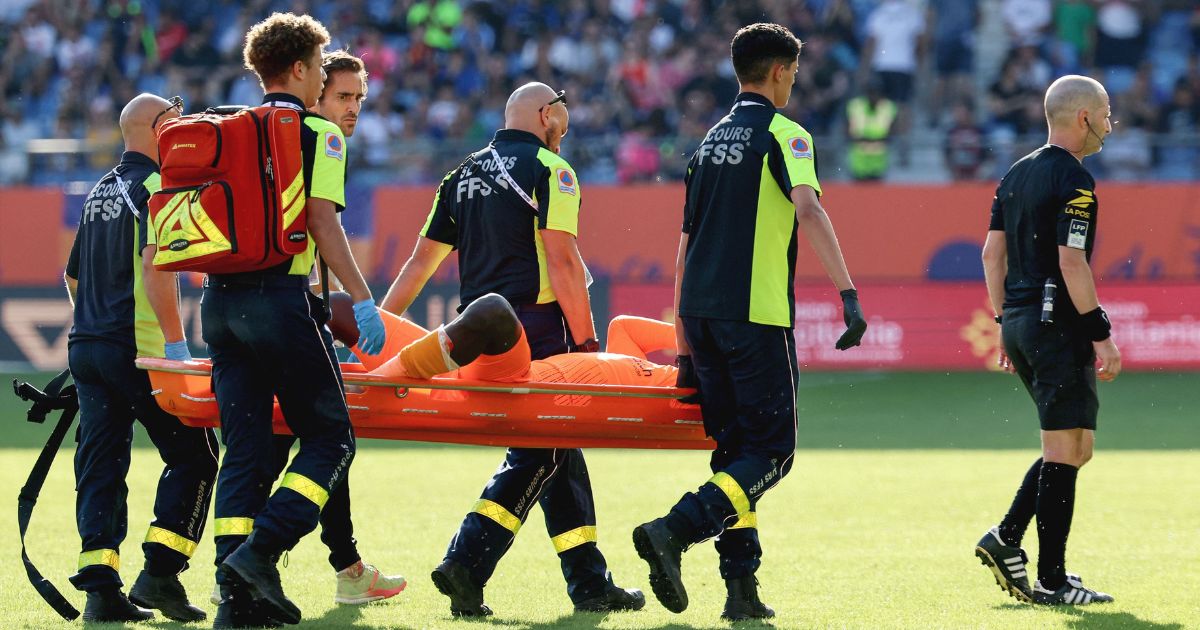 Clermont-Ferrand's French goalkeeper #99 Mory Diaw injured by a firecracker, is evacuated on a stretcher during the French L1 football match between Montpellier Herault SC and Clermont Foot 63 at Stade de la Mosson in Montpellier, southern France on Sunday.