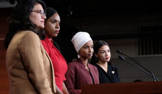 Rep. Rashida Tlaib (D-MI), Rep. Ayanna Pressley (D-MA), Rep. Ilhan Omar (D-MN), and Rep. Alexandria Ocasio-Cortez (D-NY) pause between answering questions during a press conference at the U.S. Capitol on July 15, 2019 in Washington, D.C.