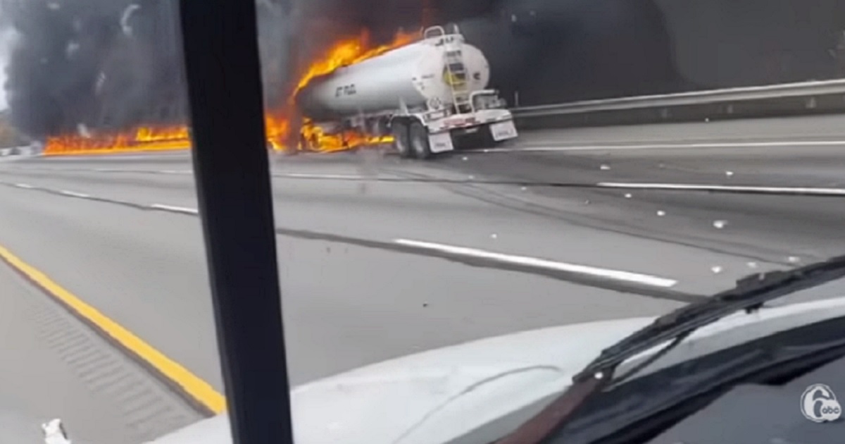 A tanker truck carrying jet fuel burns on the Pennsylvania Turnpike on Saturday after a crash that killed two and snarled traffic for hours.