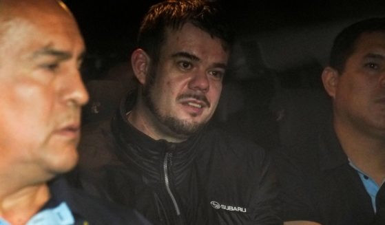 Dutch citizen Joran van der Sloot is driven in a police vehicle from a maximum-security prison to an airport to be extradited to the U.S., on the outskirts of Lima, Peru, on June 8.