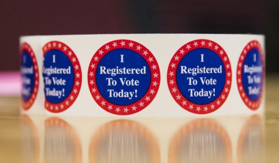 The above image is of stickers saying, "I registered to vote today."