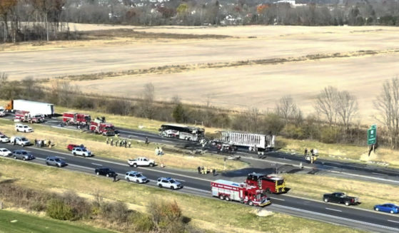 Emergency responders work the scene after a semi-truck crashed into a charter bus carrying high school students in Licking County, Ohio, on Nov. 14.