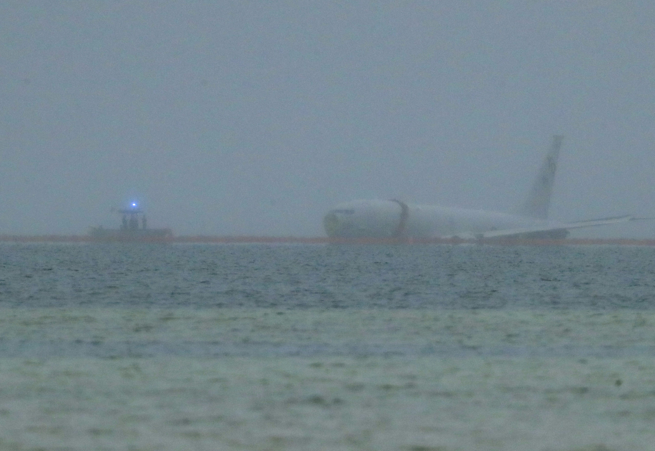 A U.S. Navy aircraft is seen in Kaneohe Bay in Hawaii on Monday. The plane overshot a runway and landed in the water.