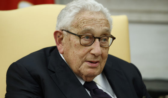 Former Secretary of State Henry Kissinger speaks during a meeting with then-President Donald Trump in the Oval Office of the White House in Washington on Oct. 10, 2017.