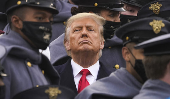 Then-President Donald Trump watches the first half of the 121st Army-Navy football game at the United State Military Academy in West Point, New York, on Dec. 12, 2020.