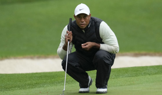 Tiger Woods lines up a putt on the 16th hole during the second round of the Masters on April 8 in Augusta, Georgia.