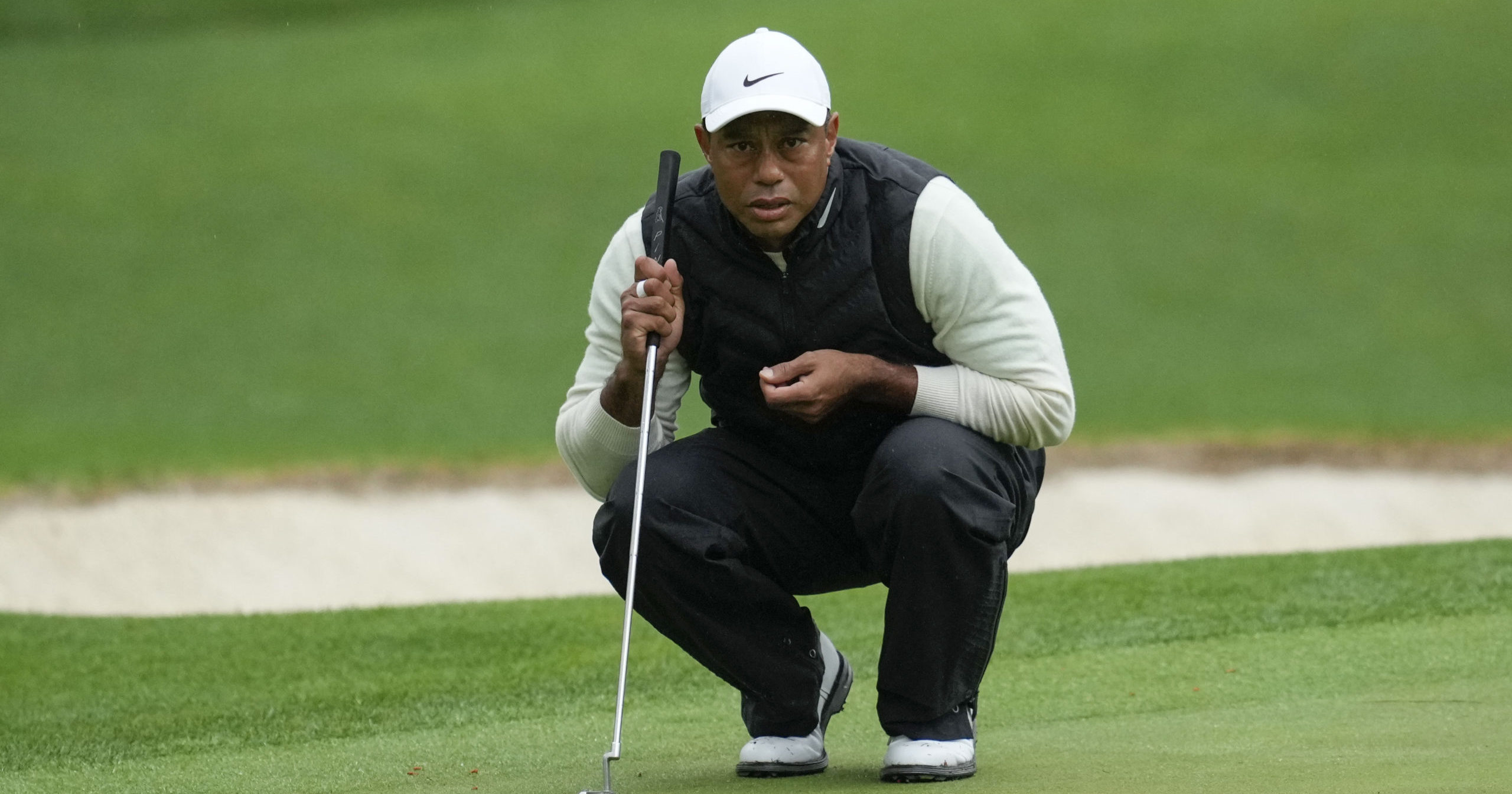 Tiger Woods lines up a putt on the 16th hole during the second round of the Masters on April 8 in Augusta, Georgia.