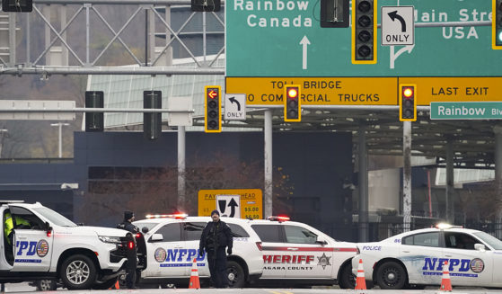Law enforcement personnel block the entrance to the Rainbow Bridge on Wednesday in Niagara Falls, New York.