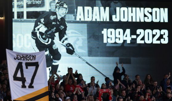 Fans hold a minute applause for ice hockey star Adam Johnson on the 47th minute during the Premier League match between Nottingham Forest and Aston Villa in Nottingham, England, on Nov. 5, following Johnson's death on Oct. 28.