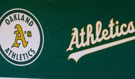 The Oakland Athletics logos are seen in the dugout before a game against the San Francisco Giants at Oakland Coliseum on July 22, 2018, in Oakland, California.