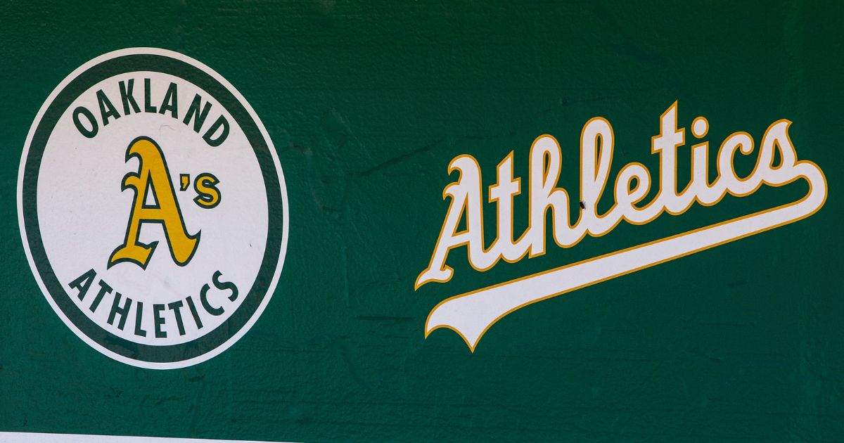 The Oakland Athletics logos are seen in the dugout before a game against the San Francisco Giants at Oakland Coliseum on July 22, 2018, in Oakland, California.