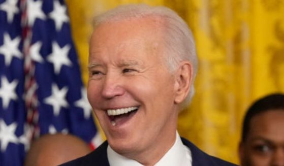 President Joe Biden is seen laughing during a White House ceremony in January.