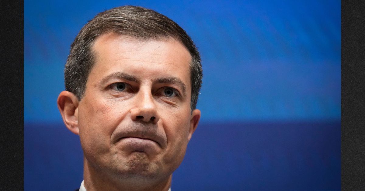 Transportation Secretary Pete Buttigieg is seen speaking during a news conference at the U.S. Department of Transportation headquarters on September 27 in Washington, D.C.