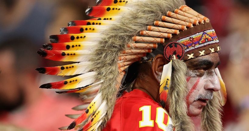 A Kansas City Chiefs fan wears a headdress and war paint during a game against the Arizona Cardinals in Glendale, Arizona, on Aug. 20, 2021. On Sunday, an image of a young Chiefs fan caused controversy due to his wearing of the headdress and black war paint.