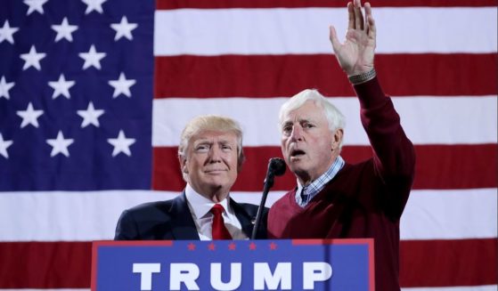 Republican presidential nominee Donald Trump, left, is introduced by former Indiana University basketball coach Bobby Knight during a campaign rally at the Deltaplex Arena on Oct. 31, 2016, in Grand Rapids, Michigan.