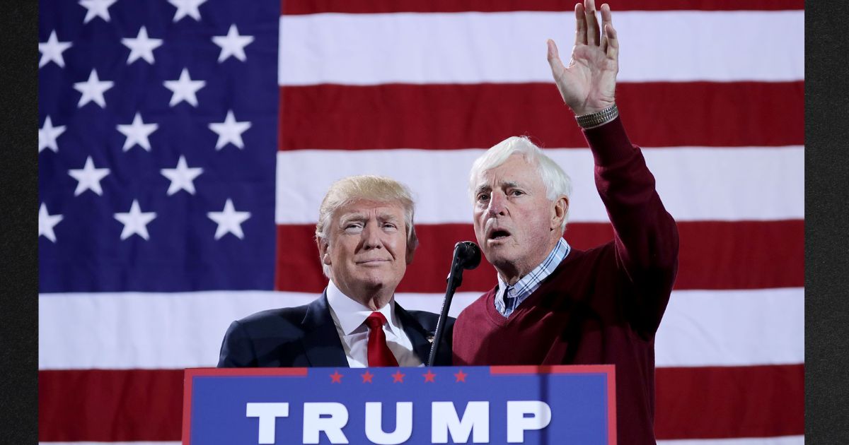 Republican presidential nominee Donald Trump, left, is introduced by former Indiana University basketball coach Bobby Knight during a campaign rally at the Deltaplex Arena on Oct. 31, 2016, in Grand Rapids, Michigan.