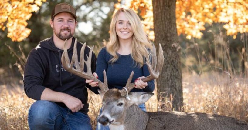 Cole Bures and Samantha Camenzind pose with a buck.