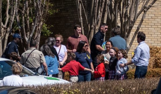 Children arrive at Woodmont Baptist Church to be reunited with their families after a mass shooting at The Covenant School in Nashville, Tennessee, on March 27. An alleged manifest from the school shooter claimed to target children due to their "white privilege."