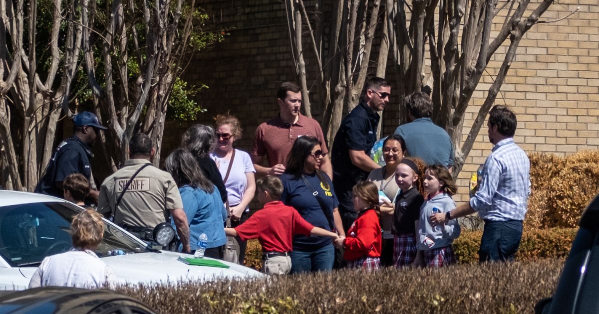 Children arrive at Woodmont Baptist Church to be reunited with their families after a mass shooting at The Covenant School in Nashville, Tennessee, on March 27. An alleged manifest from the school shooter claimed to target children due to their "white privilege."