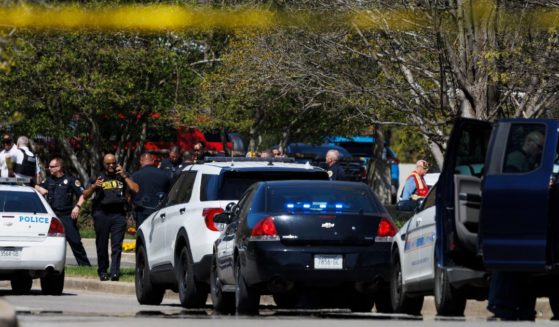 Police work near the scene of a mass shooting at The Covenant School in Nashville, Tennessee, on March 27.