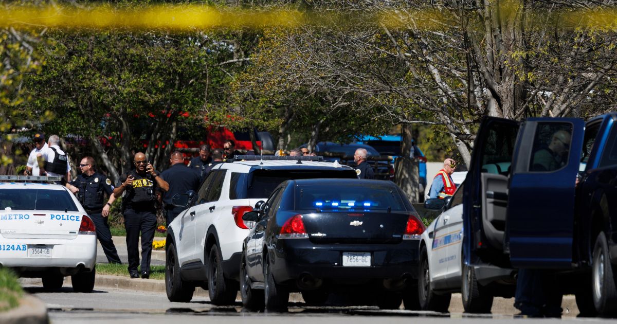 Police work near the scene of a mass shooting at The Covenant School in Nashville, Tennessee, on March 27.
