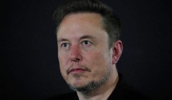 Elon Musk watching during an event with British Prime Minister Rishi Sunak in London, England, on Nov. 2. A recent X post by Musk has sparked liberal backlash, with The Washington Post claiming they will be pulling advertising from the social media platform.
