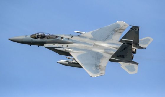 An F-15 flies in this stock image.